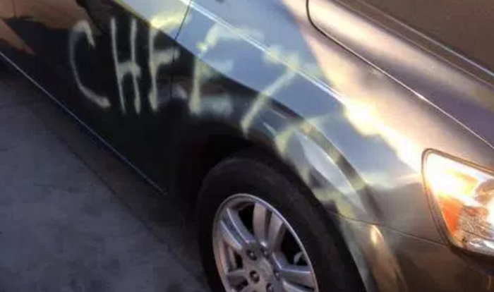 Man-Gets-Revenge-on-Ex-Girlfriend-by-Spray-Painting-Her-Car-with-Cheeter